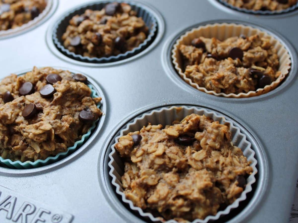 Up close photo of cooked oatmeal cups in a muffin tin. 