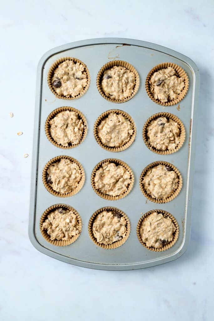 oatmeal cups in a muffin tin uncooked.