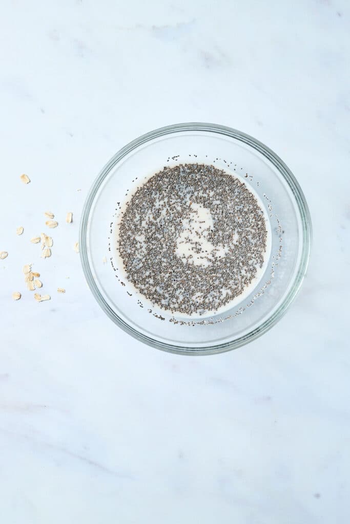 chia seeds with milk in a glass bowl.