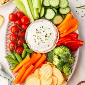 2-ingredient ranch dip with fresh veggies surrounding it.