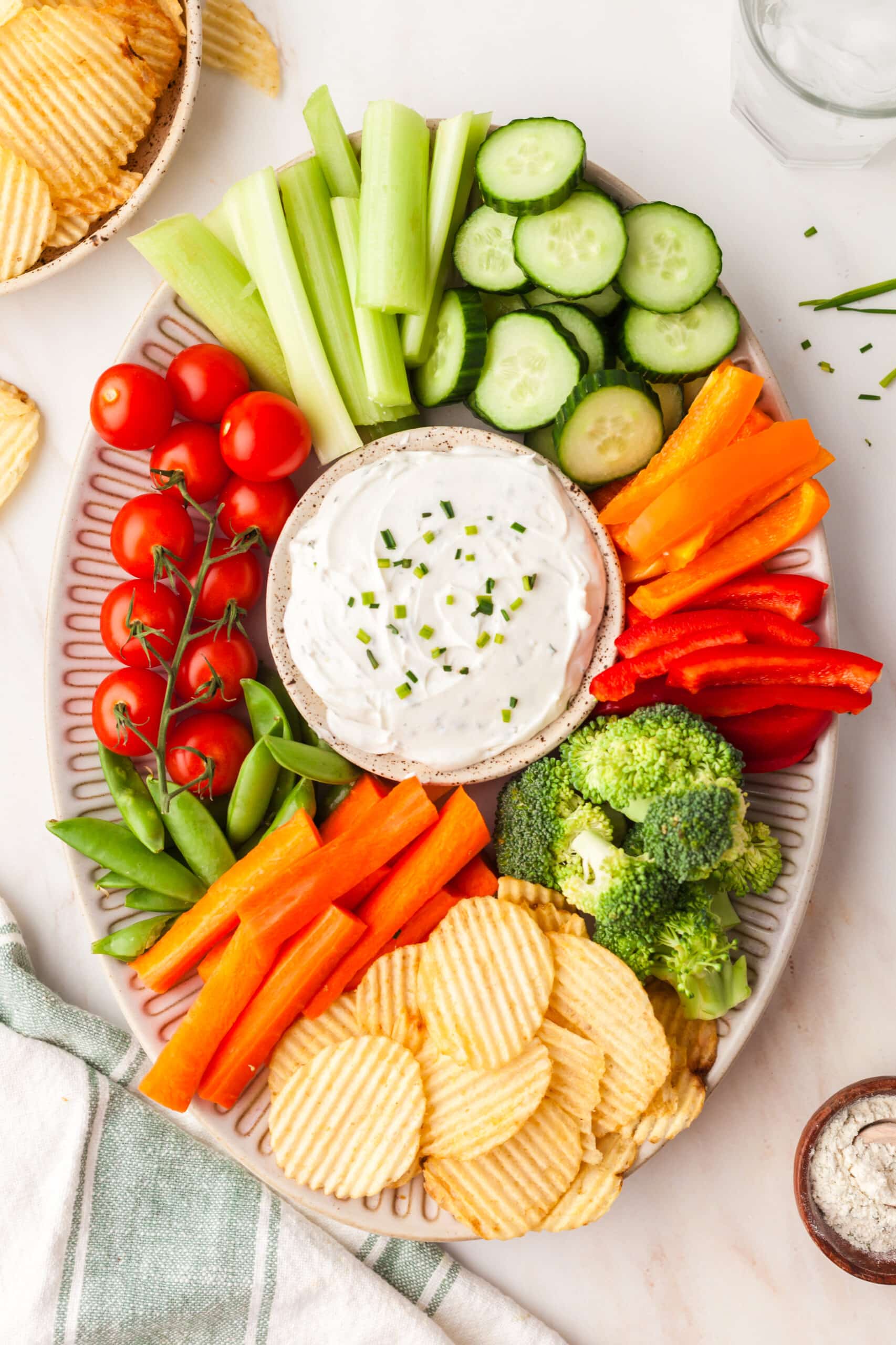 2-ingredient ranch dip with fresh veggies surrounding it.