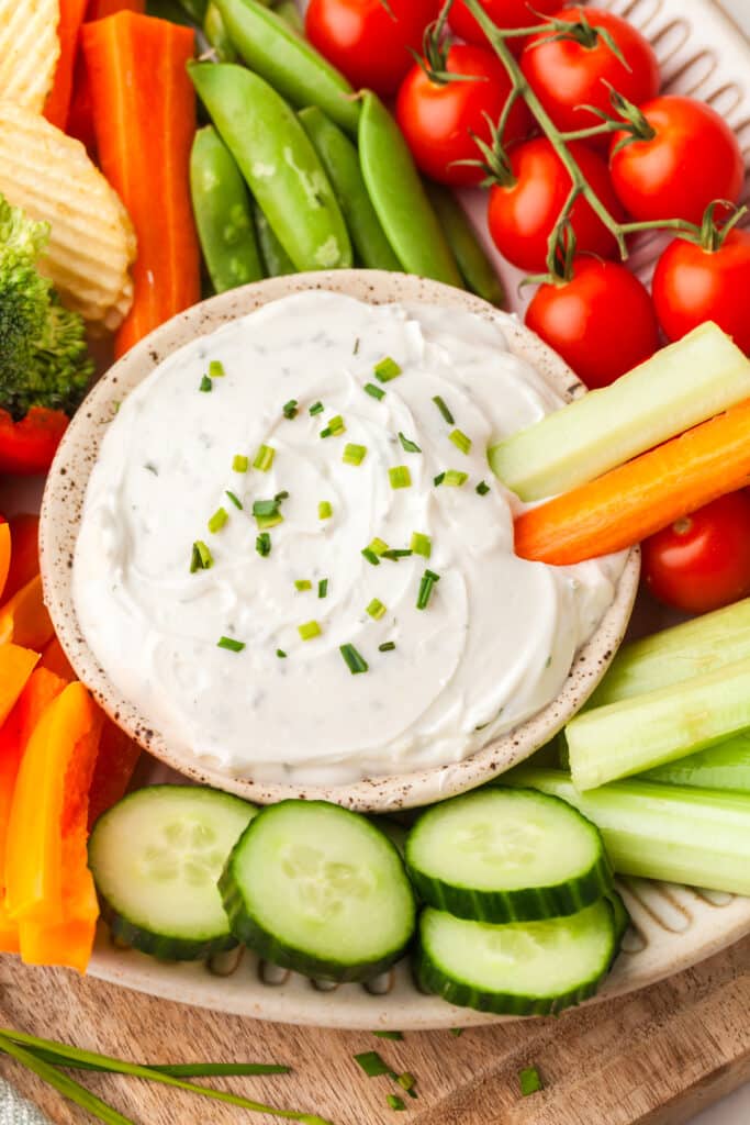 2-ingredient ranch dip with fresh veggies surrounding it.