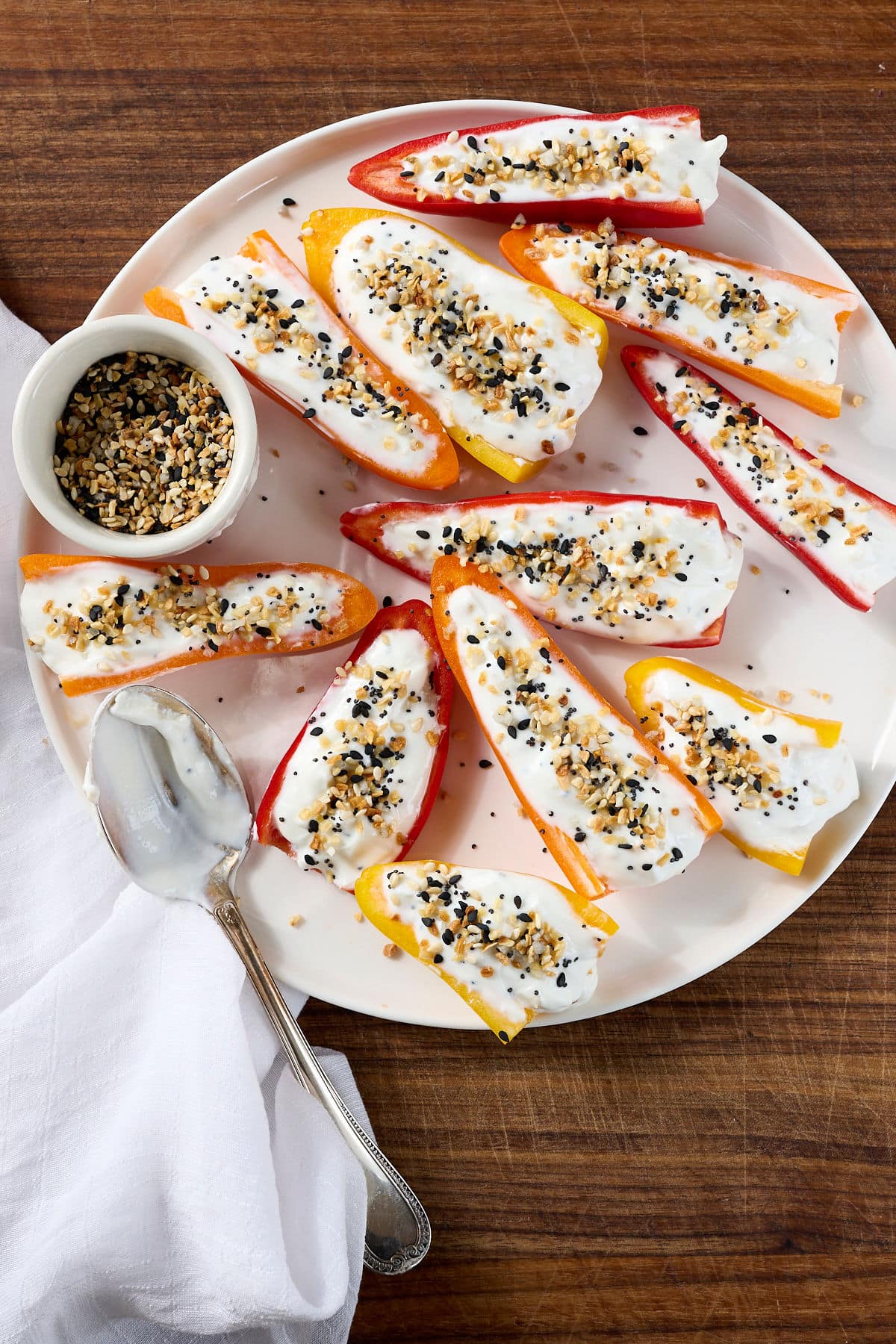 stuffed mini sweet peppers on a white plate.