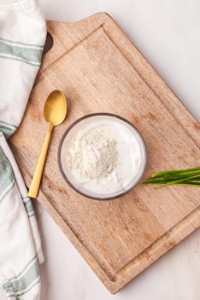 ingredients for ranch dip in a bowl unmixed.