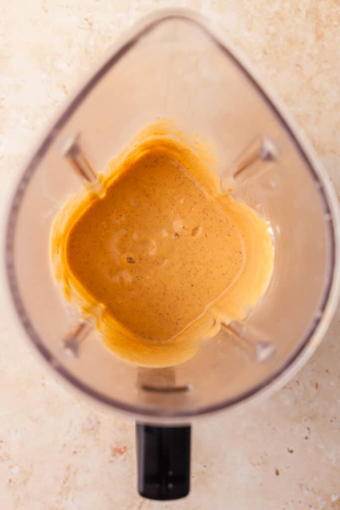 blended pumpkin smoothie in a blender.