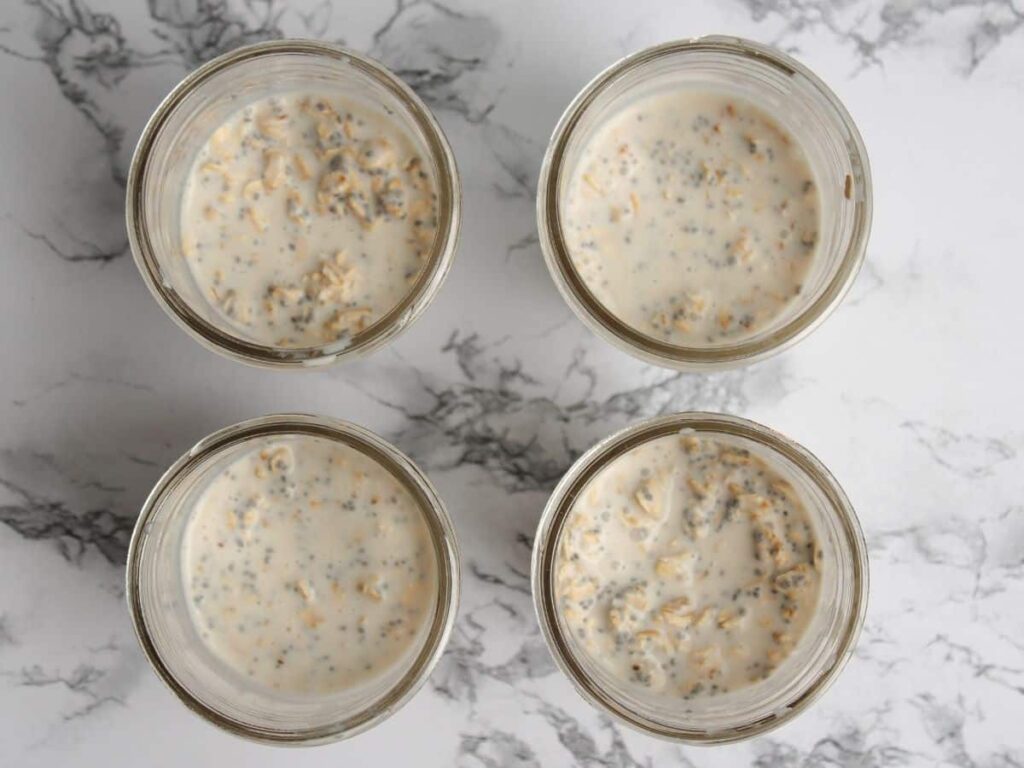 closeup of the overnight oats base recipe in mason jars