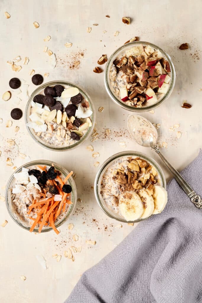overhead view of 4 different overnight oats in mason jars.