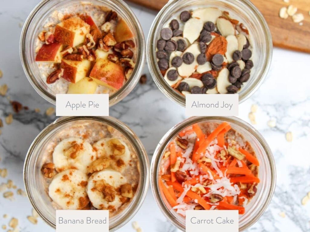 Closeup of the top of 4 overnight oat mason jar containers. The different variations are apple pie, almond joy, carrot cake, and banana bread