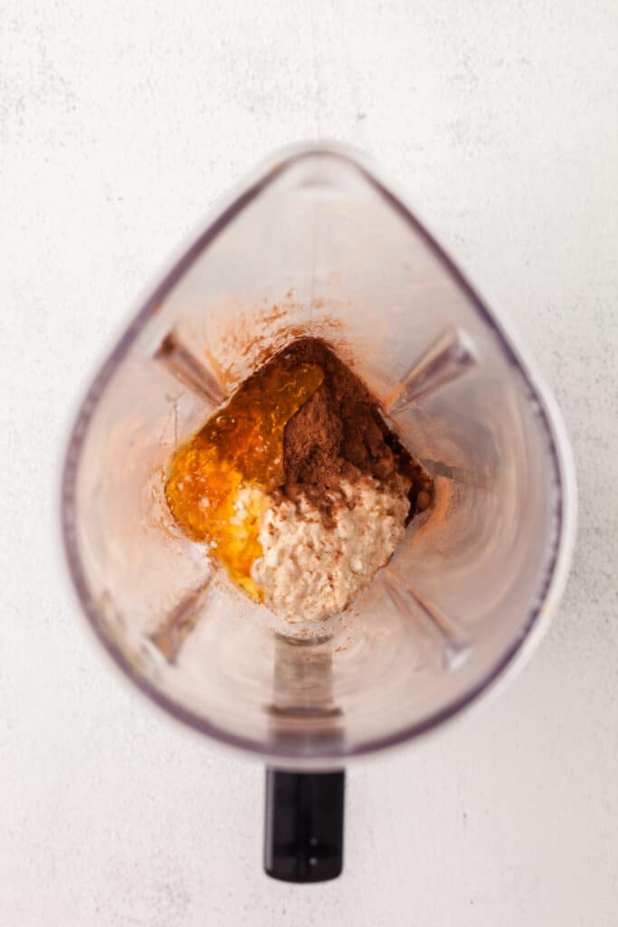 ingredients in a blender to make high protein chocolate pudding.