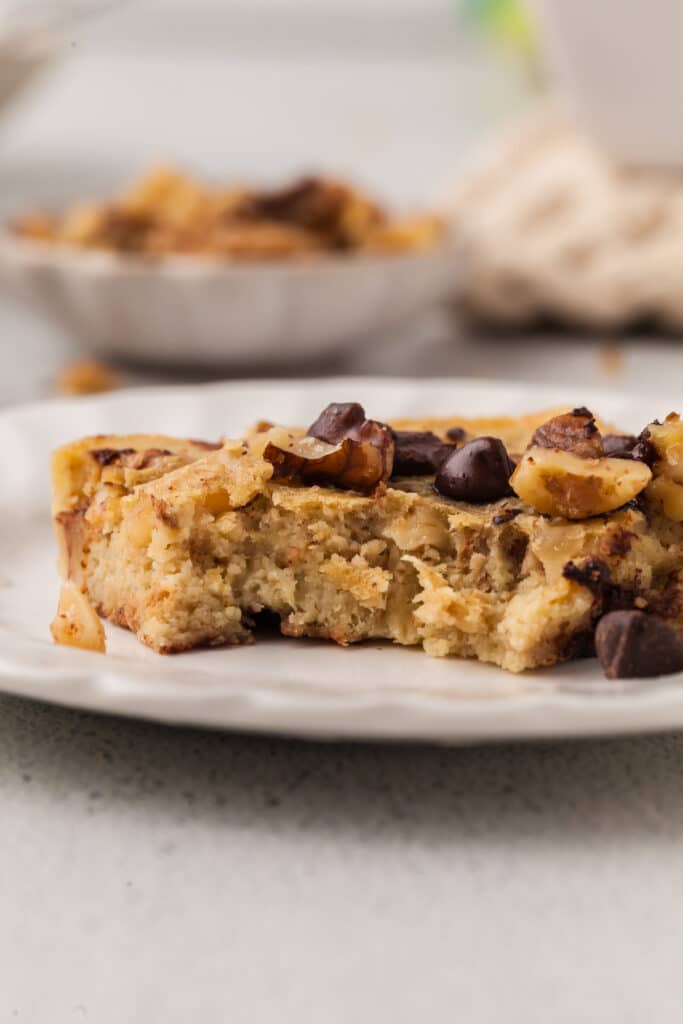 high protein baked oats serving on white plate.