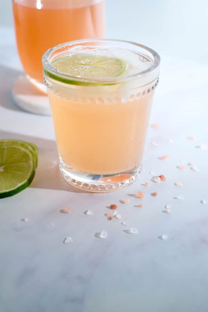 cortisol cocktail recipe in a glass with decorative salt on countertop.