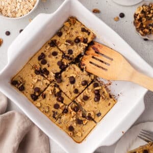 high protein baked oats in a white baking dish.