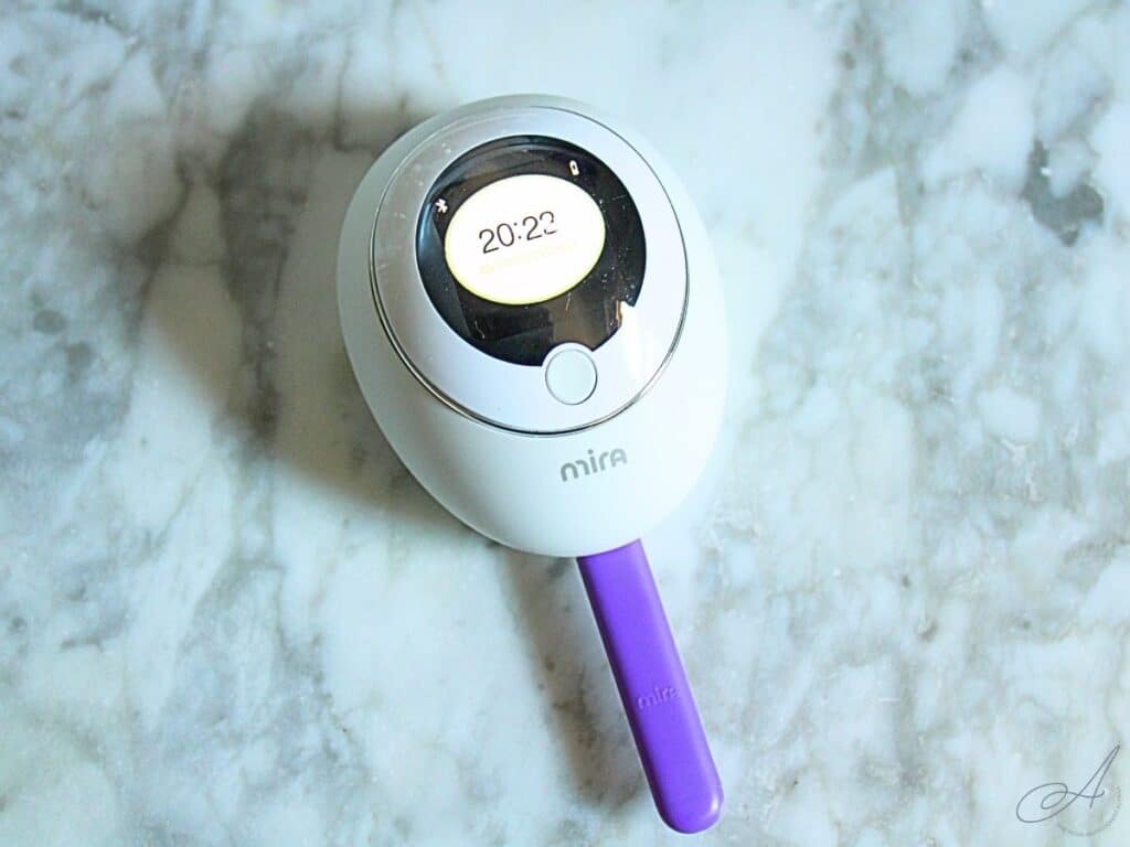 mira hormone analyzer on a countertop with a test wand inserted.