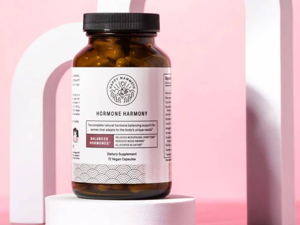 happy mammoth hormone harmony supplement with pink background.