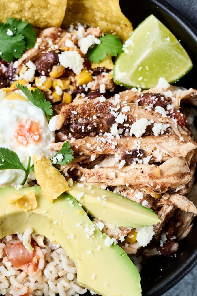 southwest chicken with avocado, tortilla chips, and sour cream.