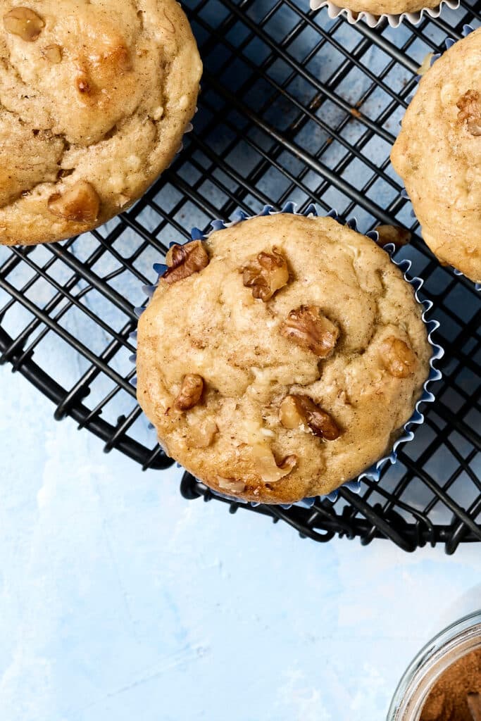 overhead view of banana cottage cheese muffin on wire rack.