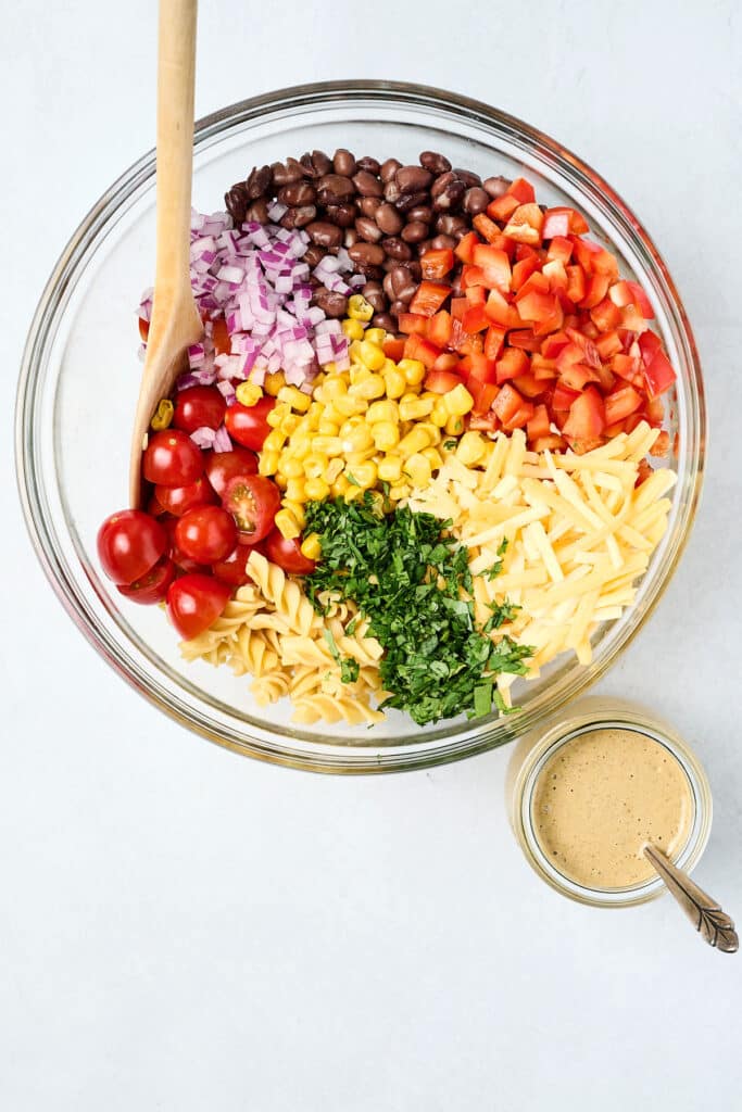 overhead view of taco pasta salad ingredients before mixed with dressing.