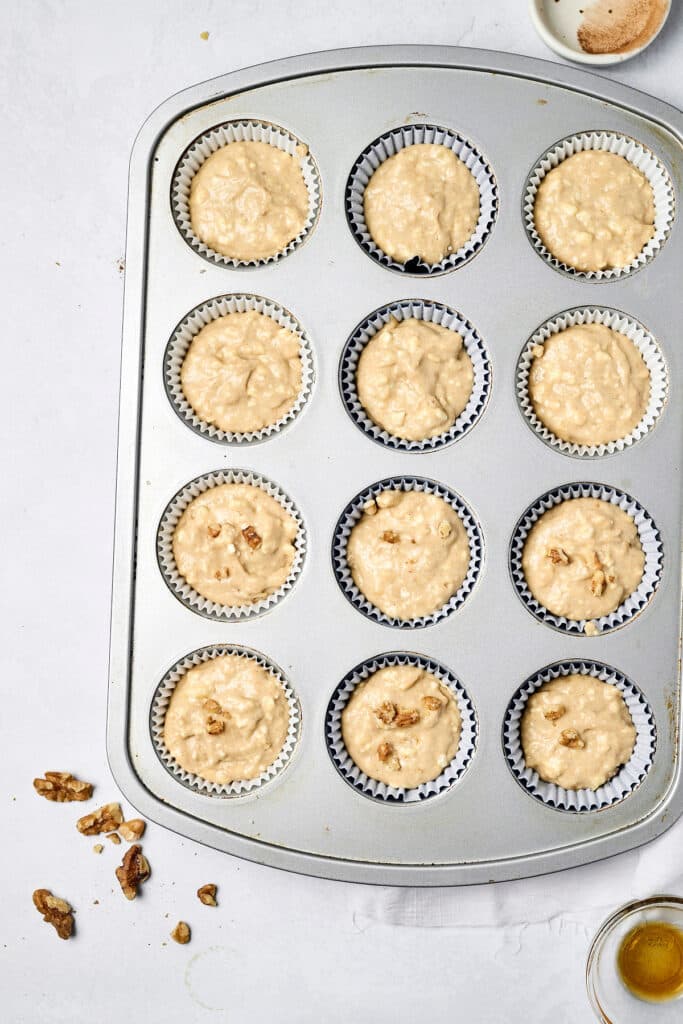 cottage cheese banana muffin batter in muffin tin before baking.
