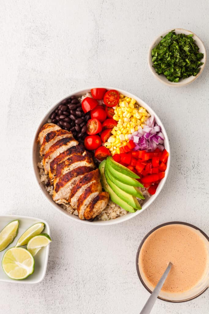 colorful southwest chicken bowl in a large white bowl.