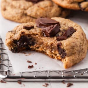 pcos friendly chocolate chip cookie with a bite taken out of it.