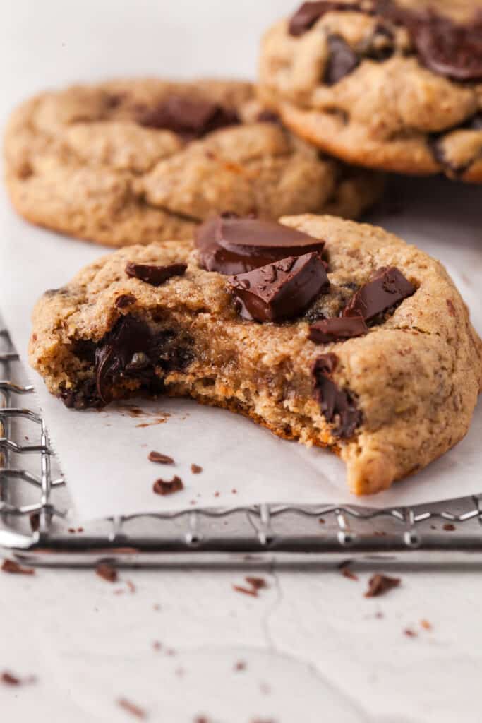 pcos friendly chocolate chip cookie with a bite taken out of it.