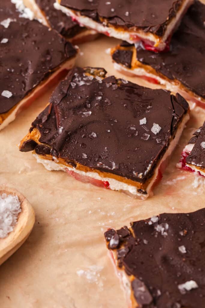 frozen cottage cheese bark pieces on parchment paper.