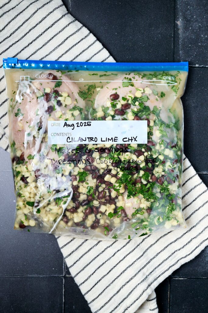 cilantro lime chicken freezer meal in a labeled gallon freezer bag.