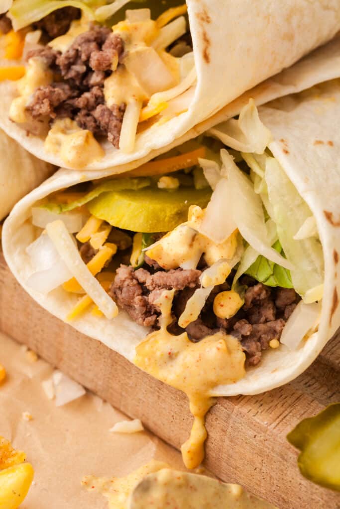 big mac wrap with sauce dripping out.