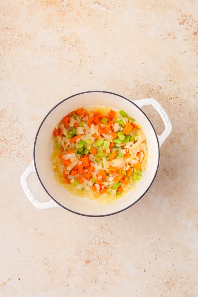 diced veggies in a large stockpot.