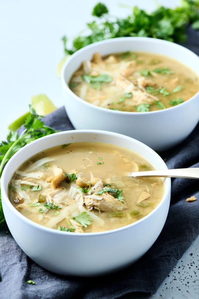 white chicken chili in two white bowls.