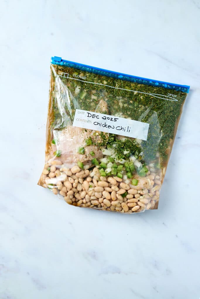 white chicken chili freezer meal in a large freezer bag.