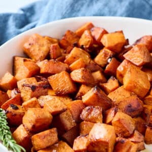 roasted pcos sweet potatoes in white bowl.