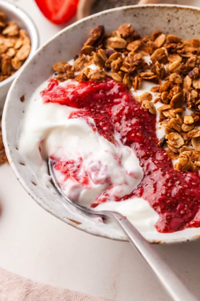strawberry chia jam on top of yogurt with granola.