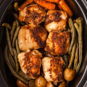 finished chicken, potatoes, and veggies in a crockpot.