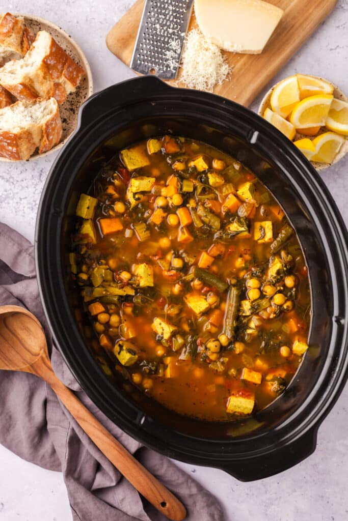 golden chickpea and veggie soup in a crockpot.