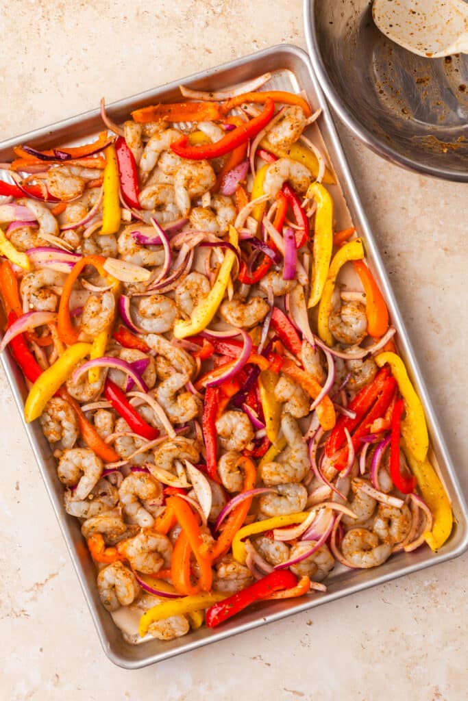 sheet pan shrimp fajitas before they go into the oven.