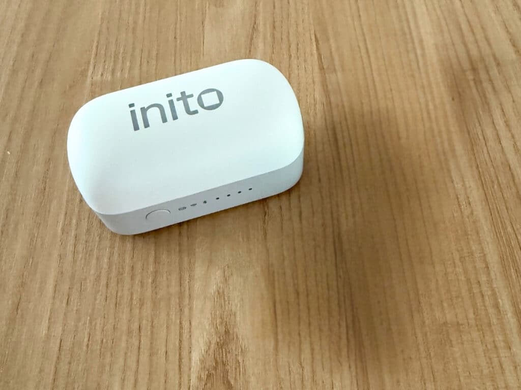 inito fertility monitor sitting on wooden countertop.