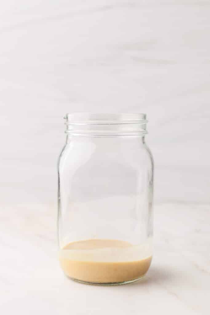 process shots of a pcos friendly mason jar salad being made.