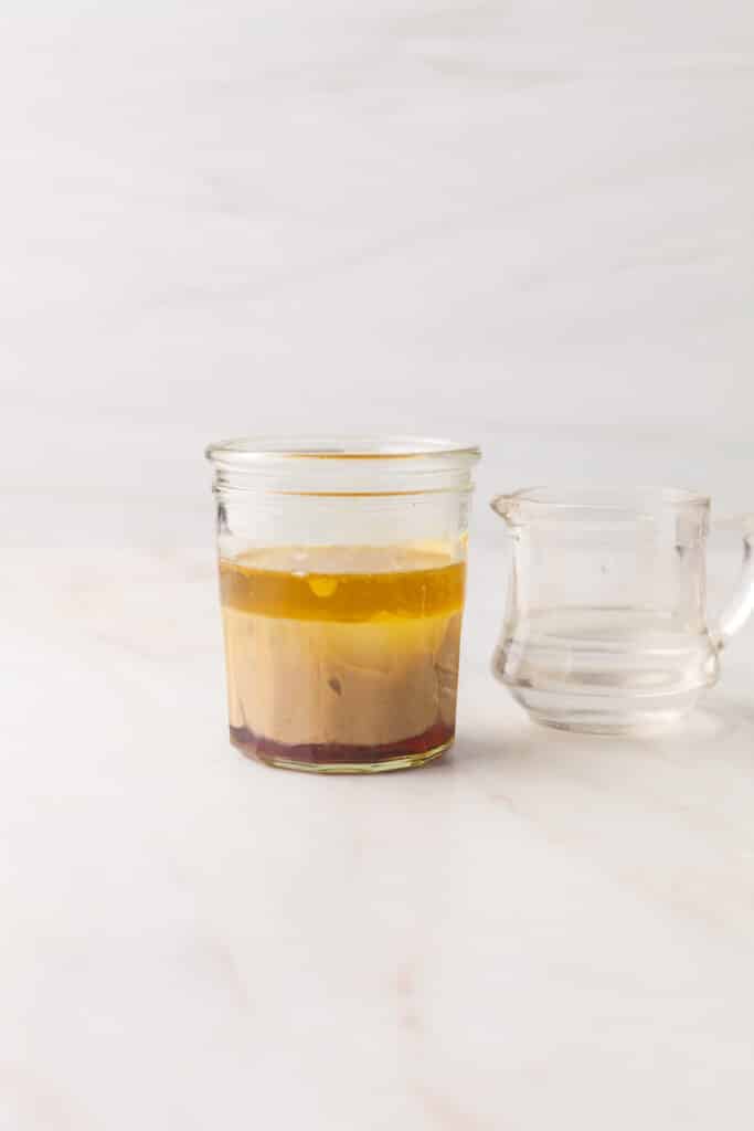 process shots of a salad dressing being made.
