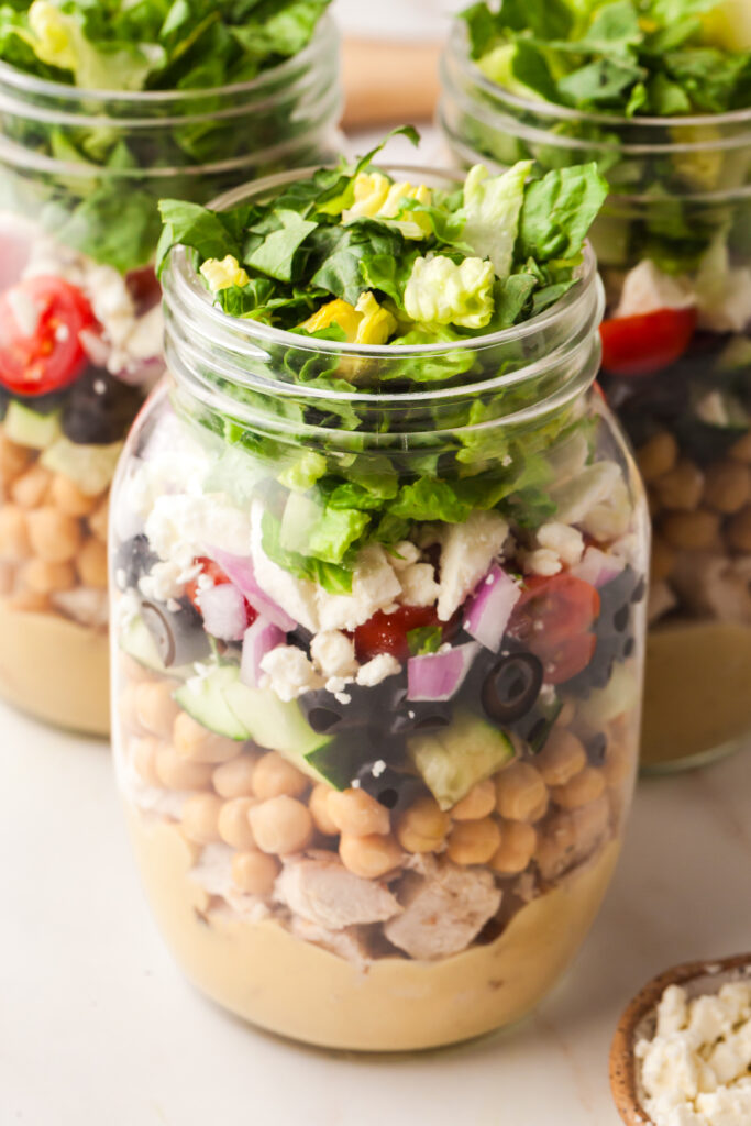 mason jar salad with cover off.